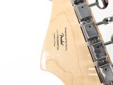 a close up of an electric guitar with a white background