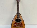 a small guitar that is sitting on a table