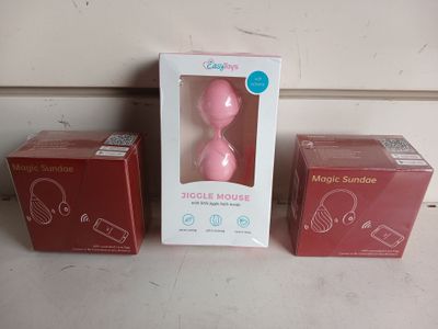 packaging of a pink magic mouse and a box of pink magic mouse