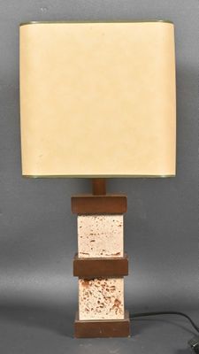 a close up of a lamp on a table with a light on it