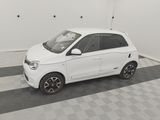a small white car that is parked in a garage