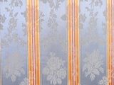 a striped couch with a wooden frame on it