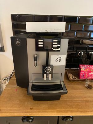 a coffee machine sitting on a counter in a kitchen