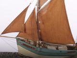 a model of a sailboat on display on a table