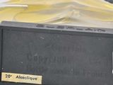 a black box with a yellow label sitting on a table
