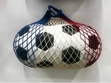two balls in a mesh bag hanging on the wall