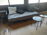 an image of a living room with a couch and a table