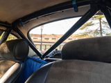 a man sitting in the back seat of a car