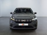 the front view of a grey car in a white room