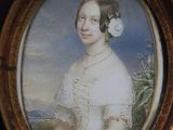 a picture of a woman with a flower in her hair