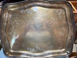 a silver tray sitting on top of a blue chair