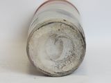 a white and brown vase sitting on a white surface