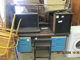 a pile of appliances and a washing machine in a room