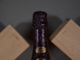 a bottle of wine that is sitting on a table