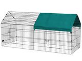 a small cage with a green cover on top of it