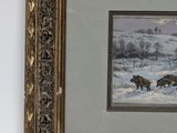 framed picture of a painting of a herd of wild horses in a snowy landscape