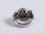 silver ring with a leopard print design on the inside of it