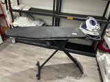a ironing board on a ironing board stand in a room