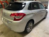 a picture of a silver car parked in a garage