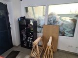 a room that has a bunch of boxes and a chair in it