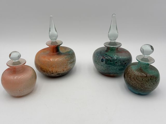 CRISTALLERIE PIERRE DE LUNE. Quatre flacons en verre multicouche ...