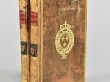 an old book with a crown on top of it