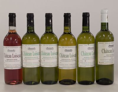 six bottles of wine are lined up in a row on a table