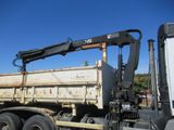 a large truck with a crane on the back of it