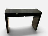 an image of a black desk with a glass top
