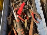 a bin full of tools that are sitting in it