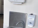 an image of a stainless steel sink in a public restroom