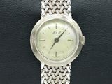 an image of a wrist watch with a chain around it