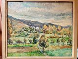 une photo d'un tableau représentant un paysage, dans un cadre en bois