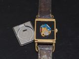 a watch that is sitting on a black surface
