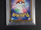 a close up of a pokemon trading card in a plastic holder