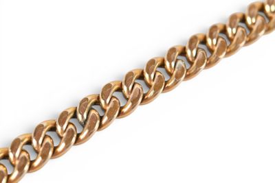 a close up of a gold chain on a white background