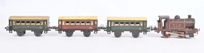 several toy trains are lined up in a row on a white surface
