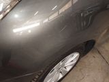 a close up of a car ' s headlight and front bumper