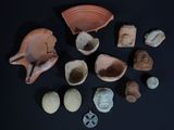 several pieces of pottery are arranged on a black surface