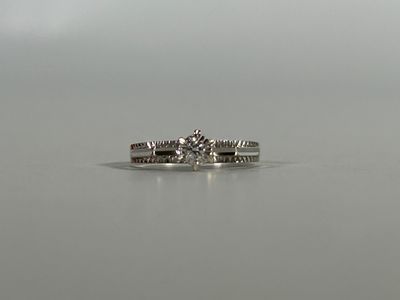 an image of a diamond ring on a table