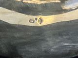 un tableau représentant un chat assis sur une valise