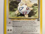 a close up of a pokemon card on a table