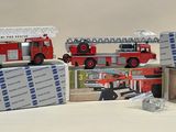 four firetrucks that are sitting on top of each other