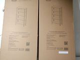 two cardboard boxes with drawings on them sitting on a table