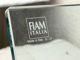 a close up of a mirror with a logo on it