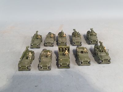 a lot of army vehicles that are sitting on the ground