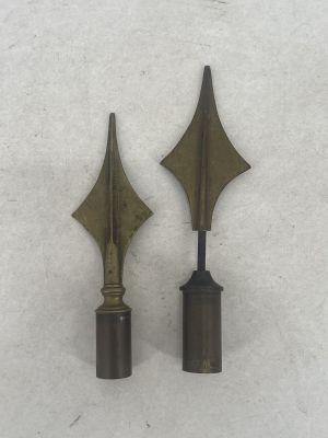 pair of antique brass arrow finings from the early 20th century