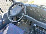 a steering wheel and dashboard of a car with a blue cloth