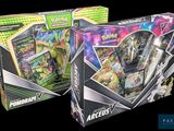 two boxes of pokemon cards are shown on a black background