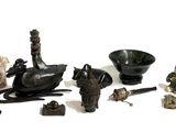 many figurines that are sitting on a white surface